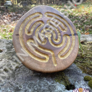 Large Brigid Style labyrinth sculpture standing on a rock