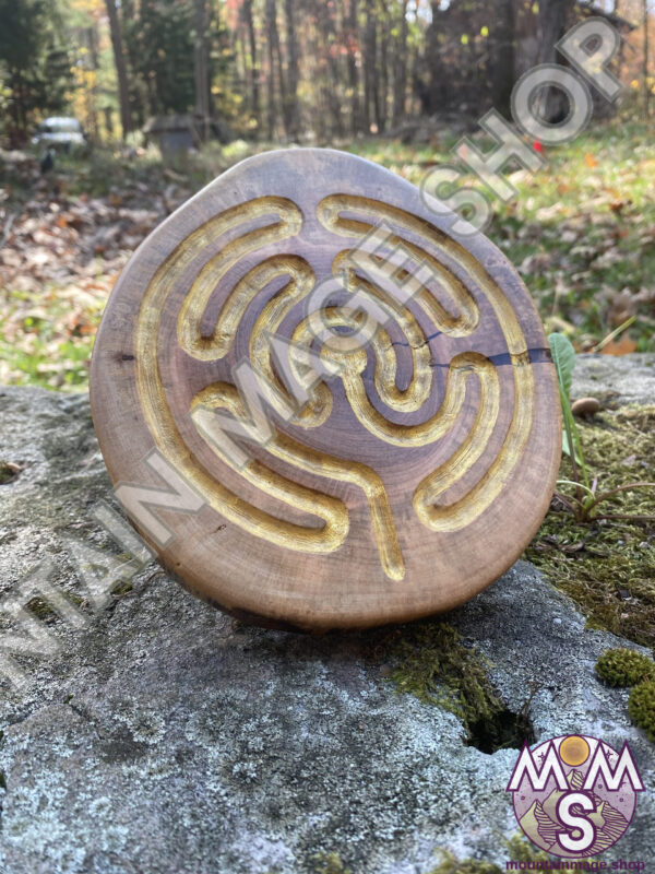 Large Brigid Style labyrinth sculpture standing on a rock